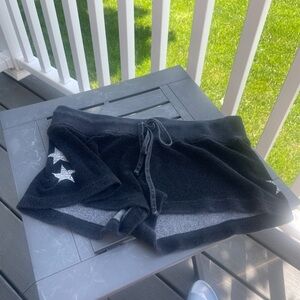 Juniors large hard tail shorts. Black with white stars